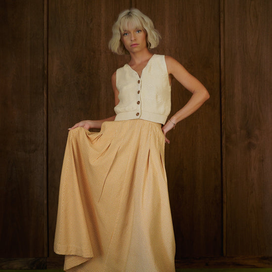 Rosemary Skirt in CandyCorn gingham held out to show the full skirt and front pleats.