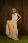 Rosemary Skirt in CandyCorn gingham held out to show the full skirt and front pleats.